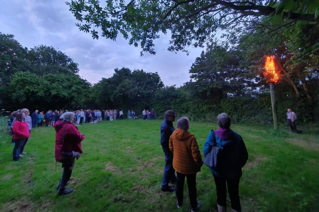Villagers gather in the meadow behind Scopwick village hall for the D-Day beacon lighting.