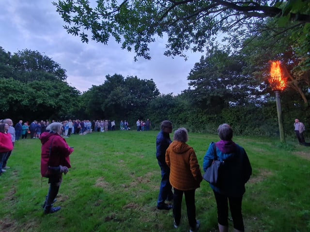 Villagers gather in the meadow behind Scopwick village hall for the D-Day beacon lighting.