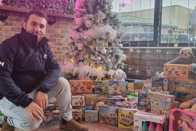 Brad Johnson of the RNLI with toys already donated to their appeal.