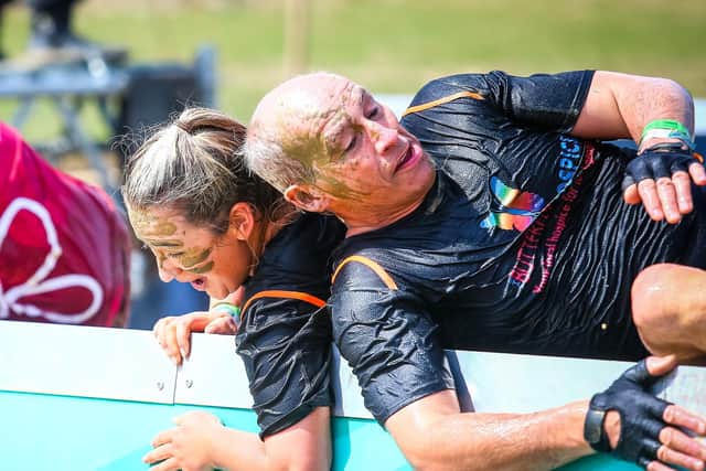 Paul Caddell and fellow team mate negotiate one of the 13 obstacles on the 5K course.