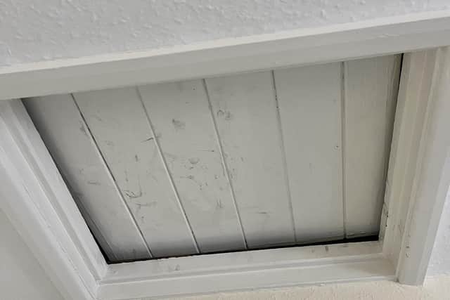 Dirty fingermarks are frequently left on this loft hatch, despite it being unused by the team.