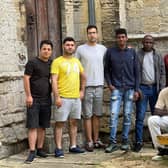 Some of the asylum seekers who took part in the volunteer work at the church.