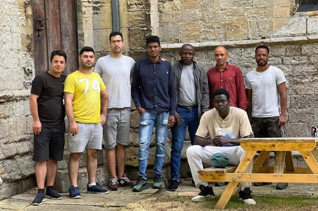 Some of the asylum seekers who took part in the volunteer work at the church.