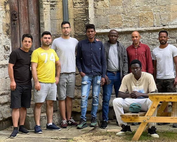 Some of the asylum seekers who took part in the volunteer work at the church.