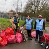 The volunteers with all the rubbish they collected on the day.