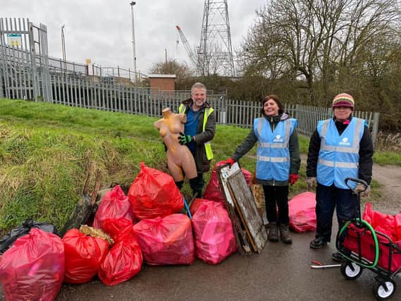 The volunteers with all the rubbish they collected on the day.