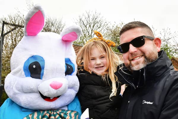 Four year old Olivia and Alex Johnston    say hello to the Easter Bunny.