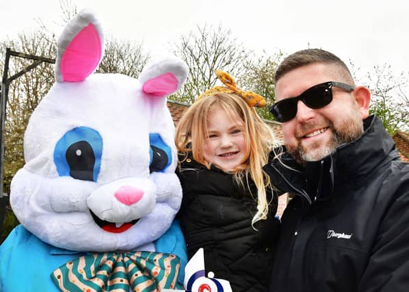 Four year old Olivia and Alex Johnston say hello to the Easter Bunny.