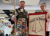 Coun Richard Wright tries on the Coat of Hopes with Sandie Stratford.