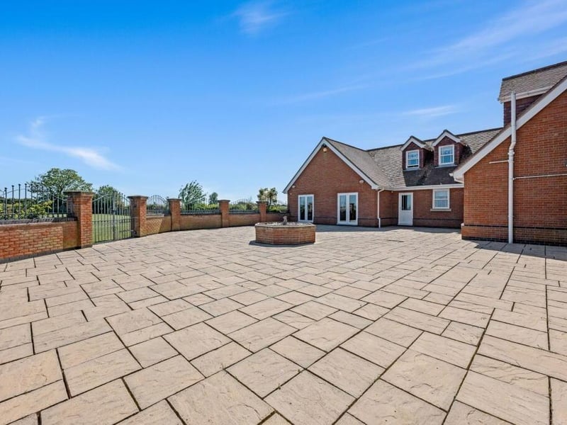 An area of patio to the rear of the home.