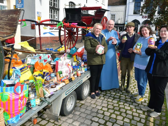 United by community spirit at the food donations event are Dani Dodds (left) and Deklan Campbell (third left), of Didi Riders And Divers, the Rev Charles Patrick, Isabel Forrester, of Horncastle Community Larder, and Raine Johnson, of Lincolnshire Co-op.