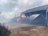 One of the buildings still on fire at the Kirk family farm in Gipsey Bridge.