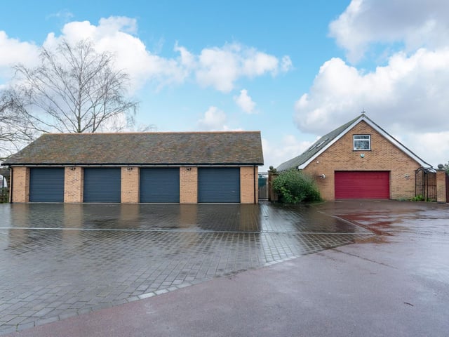 The four-bay garage and double garage.