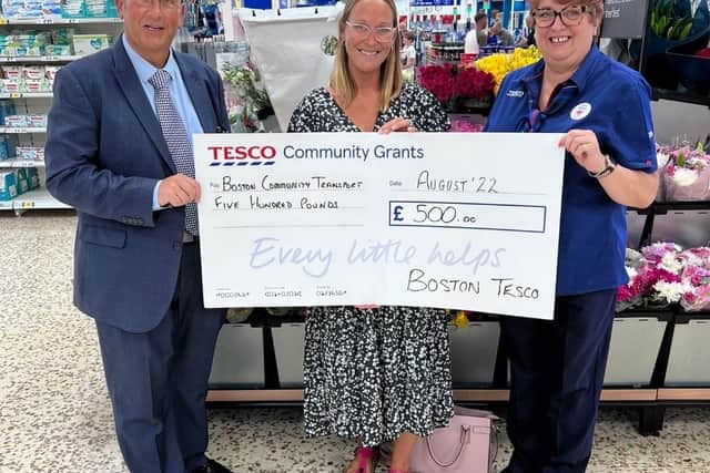 Angela Gould collects the sum for Boston Community Transport.