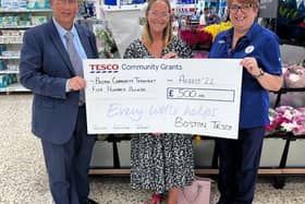 Angela Gould collects the sum for Boston Community Transport.