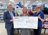 Angela Gould collects the sum for Boston Community Transport.