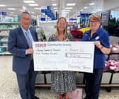 Angela Gould collects the sum for Boston Community Transport.