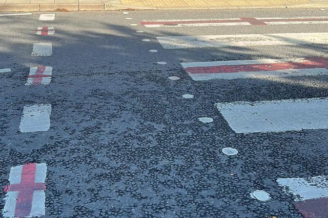 The England flag has been painted on to these road markings in Woodhall Spa.