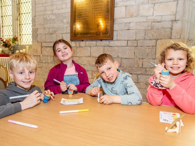 Sam Harper, nine, Georgina Harper, six, Alfie Briggs, six, and Mariska Woods, eight, painting eggs and cups.