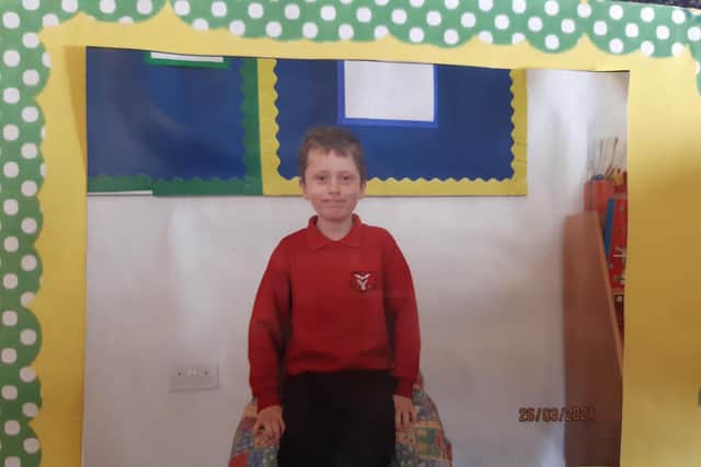 DJ Henson in his last school photo - in a homemade frame - in March 2021. photo: Caroline Vincent