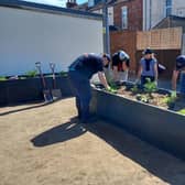 A new surface has been laid and four planters have been installed featuring a range of plants and shrubs