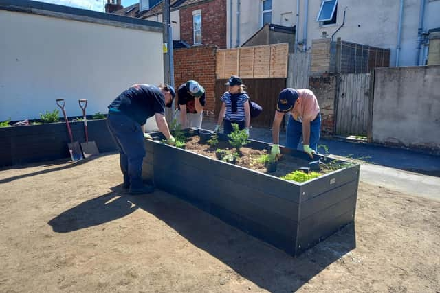 A new surface has been laid and four planters have been installed featuring a range of plants and shrubs