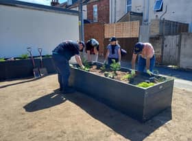 A new surface has been laid and four planters have been installed featuring a range of plants and shrubs