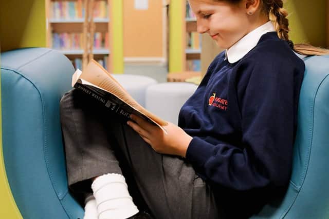 Book-lover Piper Matthews reading in the new library.