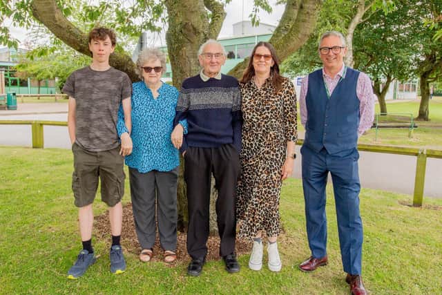 From left: Jake Shrive, Liz Lindley, Bryan Lindley, Sam Lindley and Headmaster Grant Edgar next to the tree planted in 1992 in memory of David Lindley, former RBL member.