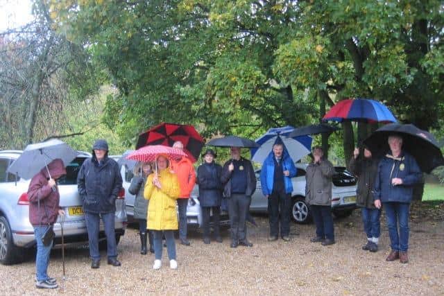 A wet walk for Rotarians