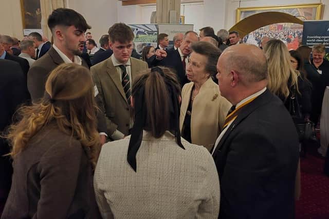 Twenty-year-old entrepreneur Harrison Towers, from Tetford, chats to Princess Anne during the event in London.