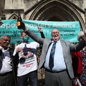 Tom Hedges outside the Appeal Court with the botle of  Prosecco  bought for him by his 93-year-old mother after his conviction was overturned.