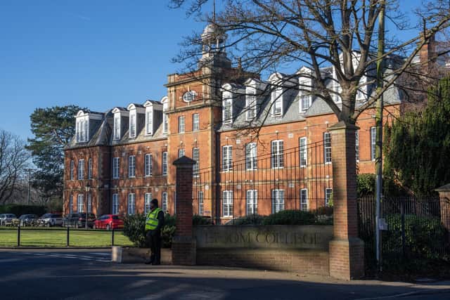A security guard stands at an entrance to Epsom College after the school's head, Emma Pattison, was found dead alongside her family yesterday, on February 6 in Epsom. (Photo by Carl Court/Getty Images)