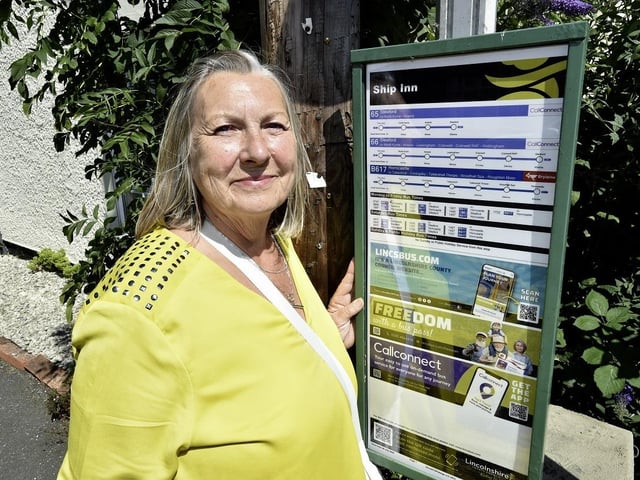 Campaign leader Coun Jane Ledger of Billinghay Parish Council and the B617 bus timetable in Billinghay. Photo: LCC