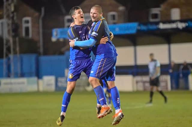Gregg Smith celebrates his second goal during Tuesday's 4-1 victory over Radcliffe with recent signing Jack Walters. PHOTO: John Rudkin
