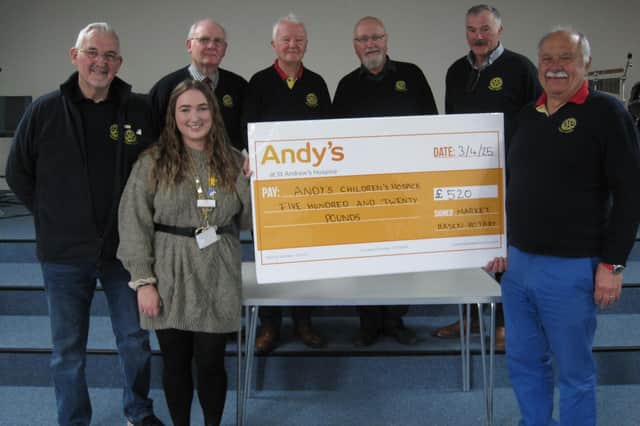 Rhea Harvey from St Andrew’s Hospice with the donation from Market Rasen Rotary Club.