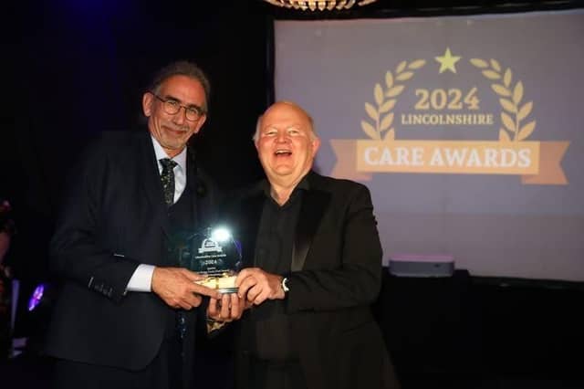 Ian Johnstone receiving his award