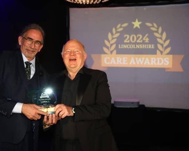 Ian Johnstone receiving his award