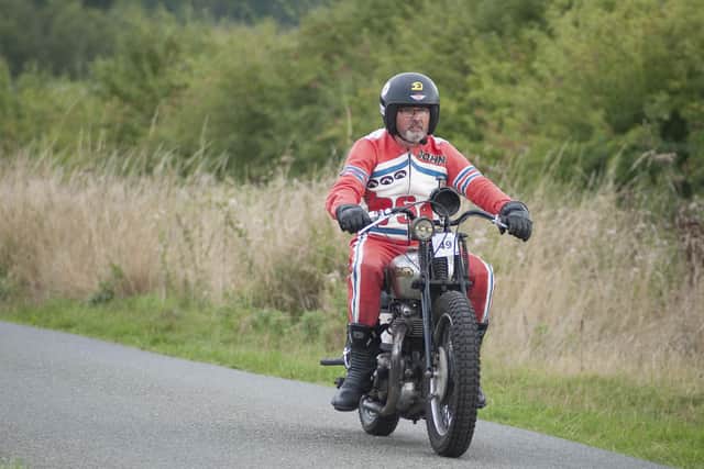 Rider 49 on a Norton "Bitza" motorcycle returns down the Hill.