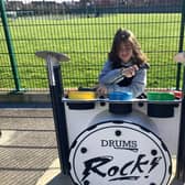 Pupil plays the drums