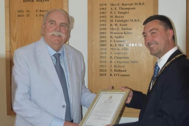 New Mayor of Skegness Coun Jimmy Brookes presents Brian O'Connor with his Honoured Citizen award.