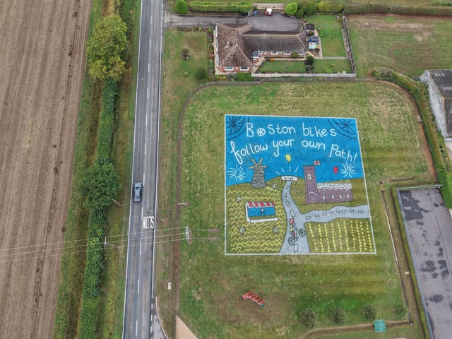 Cycle drawing by schoolgirl Imogen depicting the race making its way through the countryside. This is a recreation of Imogen's winning image from a competition across Boston’s schools. The drawing includes a church and windmill. Location: Ireland’s Farm Machinery, Main Road, Boston, PE22 7HX.