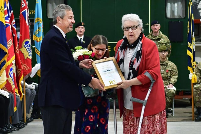 Poppy Appeal volunteer Grace Knightall receives recognition for 50 years service.