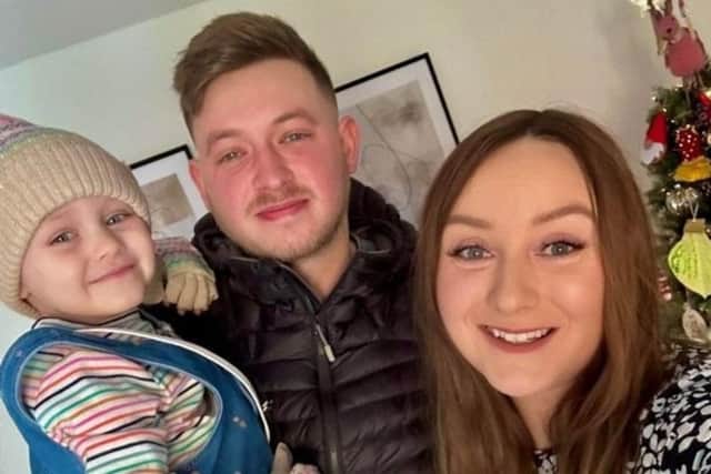Lily with her dad Josh and mum Emily.
