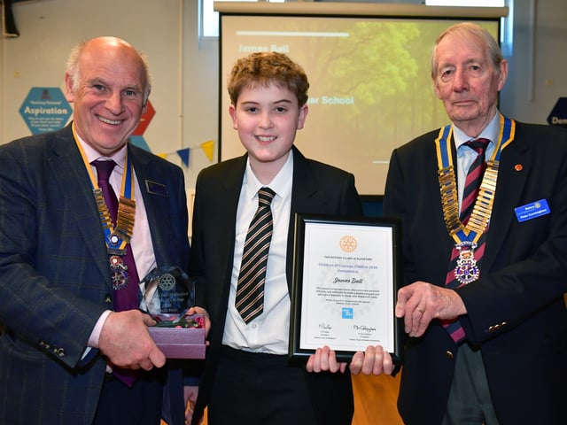 James Ball being presented an award from L-R Rotary presidents Keith Phillips and Peter Cunningham. Photo: David Dawson