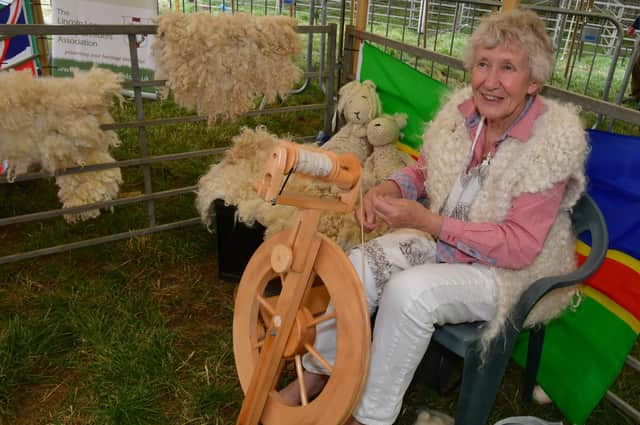 Why not visit the festival of fibre? Pauline Johnson spinning Lincoln Longwool wool at Heckington Show.