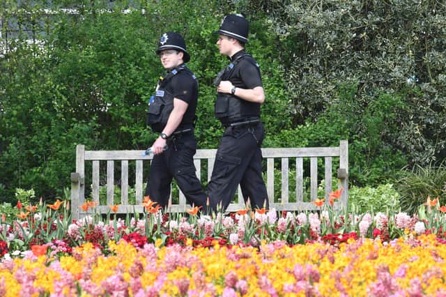 Police patrol in Jephson Gardens in Leamington Spa in central England on April 9, 2020, as Britain continues to battle the outbreak of new coronavirus and the governement prepared to extend the nationwide lockdown. - Britain geared up for a fine long Easter weekend under lockdown with the authorities appealing to the public to stay home and observe social distancing. The new coroavirus has struck at the heart of the British government, infected more than 60,000 people nationwide and killed over 7,000, with another record daily death toll of 938 reported on April 8. (Photo by JUSTIN TALLIS / AFP) (Photo by JUSTIN TALLIS/AFP via Getty Images)