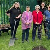 A tree donated by Chapel Garden Centre is planted at Chapel Village Hall as part of a community campaign run for the coronation.