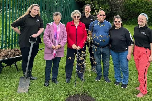 A tree donated by Chapel Garden Centre is planted at Chapel Village Hall as part of a community campaign run for the coronation.