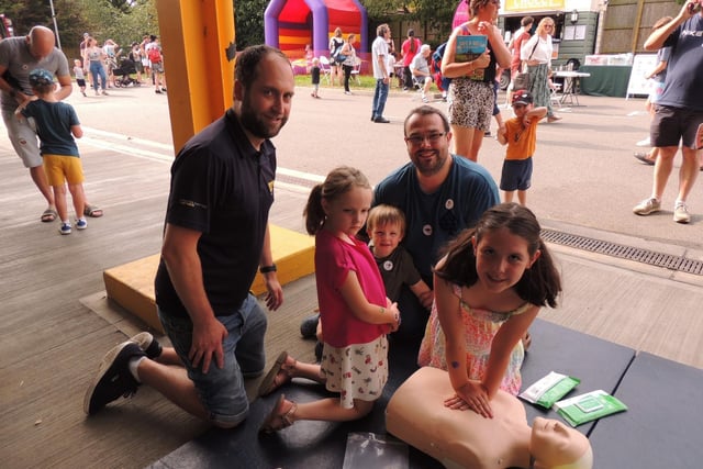 LIVES volunteer Luke Middleton showing CPR to Joe Hemming and his children Zach, four, Ruby, six, and Isla, eight, from Sleaford.